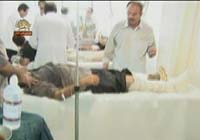 Bless&eacute;s allong&eacute;s dans la clinique d'Achraf pendant l'attaque sauvage des forces irakiennes