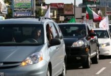 Klaxons et drapeaux, les Iraniens de New York fêtent la sortie de liste de l’OMPI