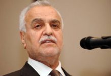 Le vice-président en exil de l’Irak appelle à un partage du pouvoir avec les sunnites